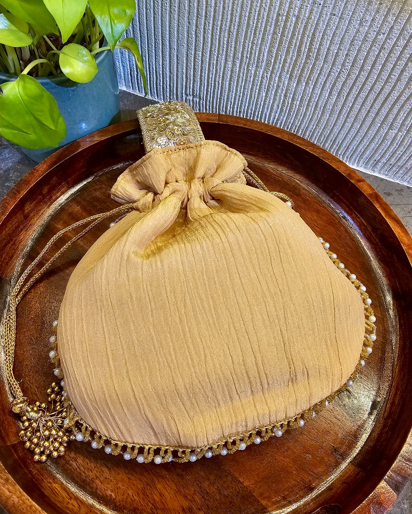 All Gold handle Potli