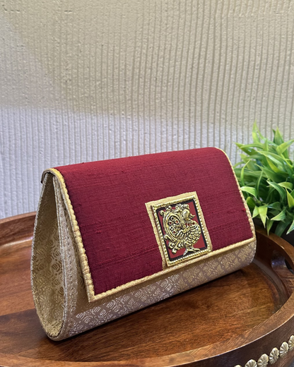 The tanjore art clutch-maroon